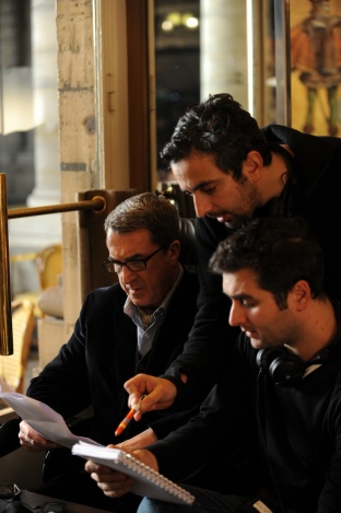 Writers and codirectors writer/directors Eric Toledano, center, and Olivier Nakache, right, on the set with François Cluzet